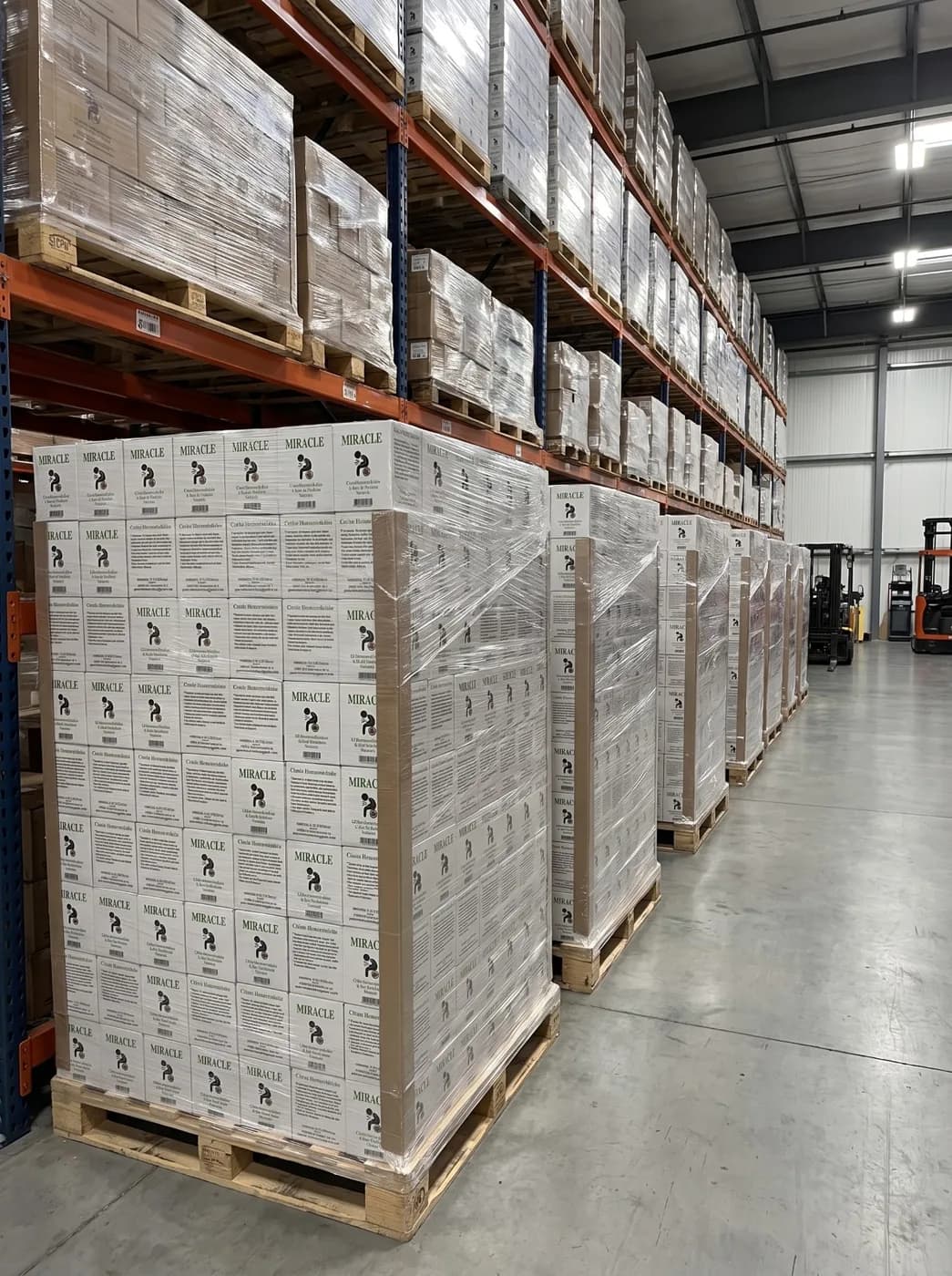 Rows of Miracle cream pallets on warehouse racking